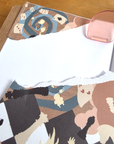 Alice washi sticker page torn into pieces and used to decorate a journal