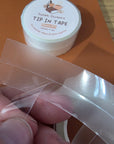 Tip in tape